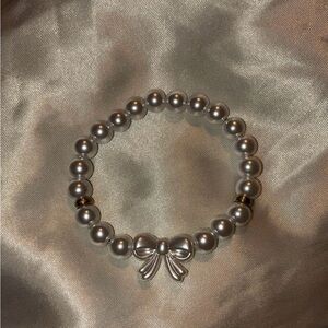 Elegant Silver Pearl Bracelet with Bow Charm